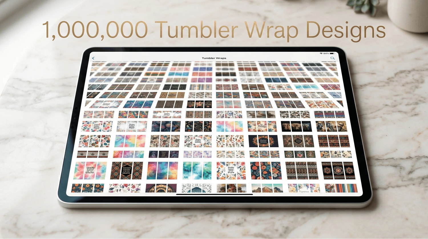 Tablet displaying 1,000,000 tumbler wrap designs on a marble surface with a cup and plant.
