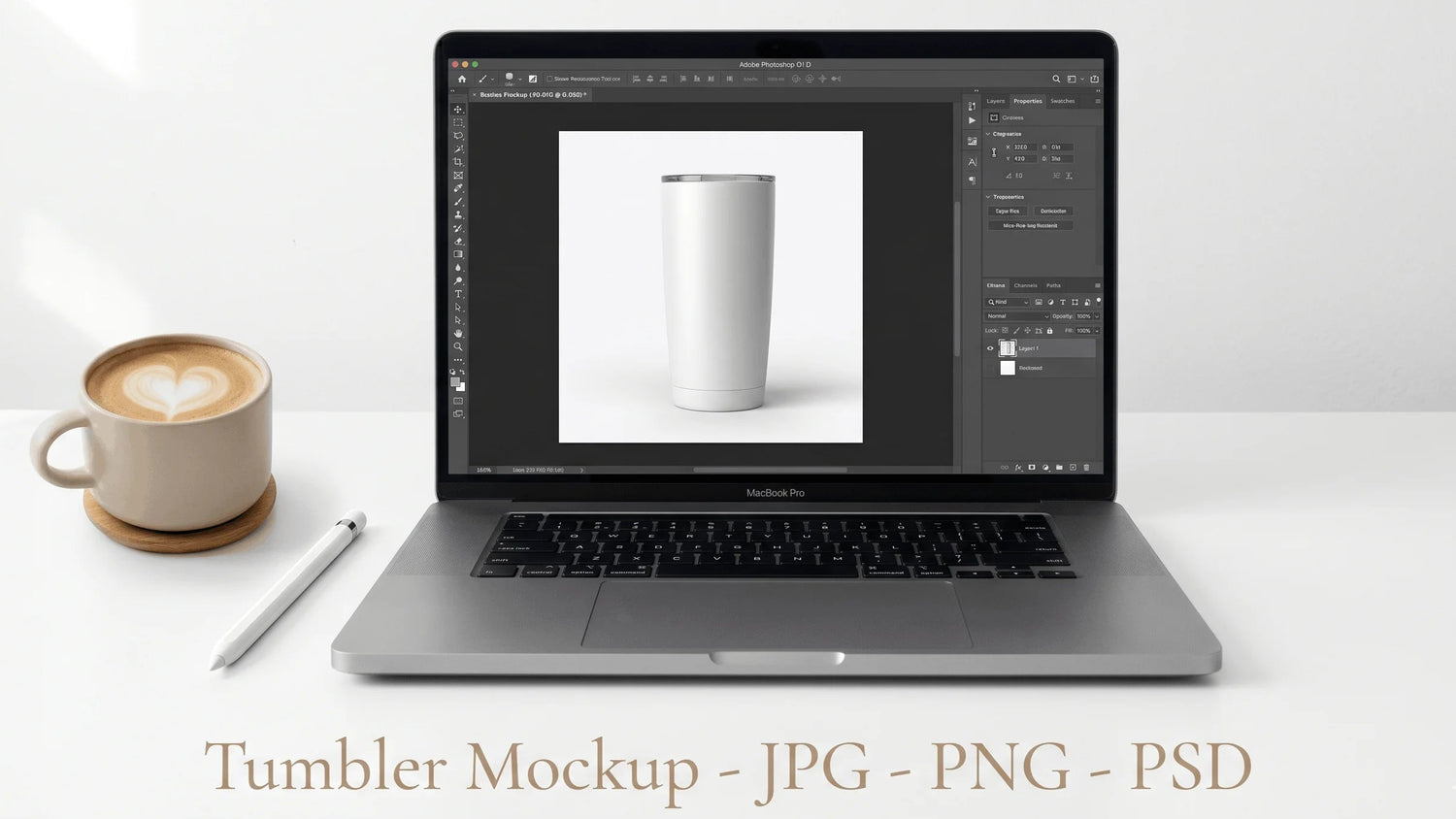 Laptop displaying a tumbler mockup on a white surface with a cup of coffee.